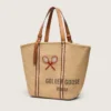 24.7 tote in natural raffia and brown leather with gold metal details