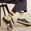 Aged-white socks with distressed details and two-tone stripes