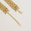 Antique gold-colored braided chain necklace with star-shaped clasp