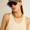 Antique gold-colored braided chain necklace with star-shaped clasp