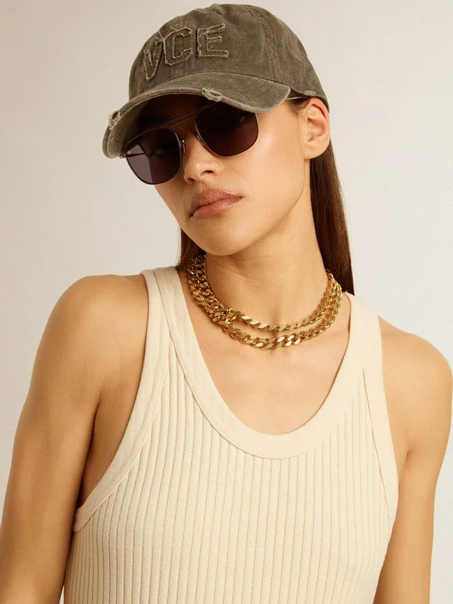 Antique gold-colored braided chain necklace with star-shaped clasp