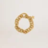 Antique gold-colored woven chain bracelet with star-shaped clasp