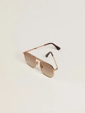 Aviator-style sunglasses with gold frame and beige lenses