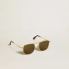 Aviator style sunglasses with gold frame and green lenses