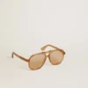 Aviator style sunglasses with honey-colored frame and lenses