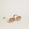 Aviator style sunglasses with rose-gold frame and honey-colored lenses