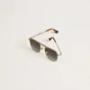 Aviator style sunglasses with silver frame and blue lenses