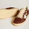 Ball Star in burgundy glitter with white leather star and heel tab