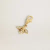Bee-shaped charm in gold-colored brass with crystals