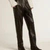 Black joggers in nappa leather with zip at the base