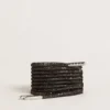 Black laces with silver-colored Swarovski rhinestones