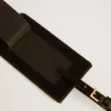 Black luggage tag