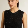 Black mesh knit top with sequins and contrasting details