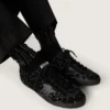 Black socks with distressed details and rhinestones