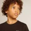 Black T-shirt with contrasting white logo on the front and maxi star on the back