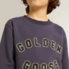 Blue-violet sweatshirt with Golden Goose lettering on the front