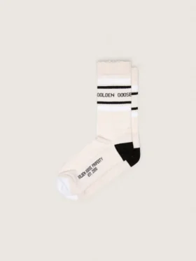 Blush-colored socks with distressed details and black and white stripes