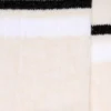 Blush-colored socks with distressed details and black and white stripes