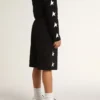 Boys’ black Bermuda shorts with white stars