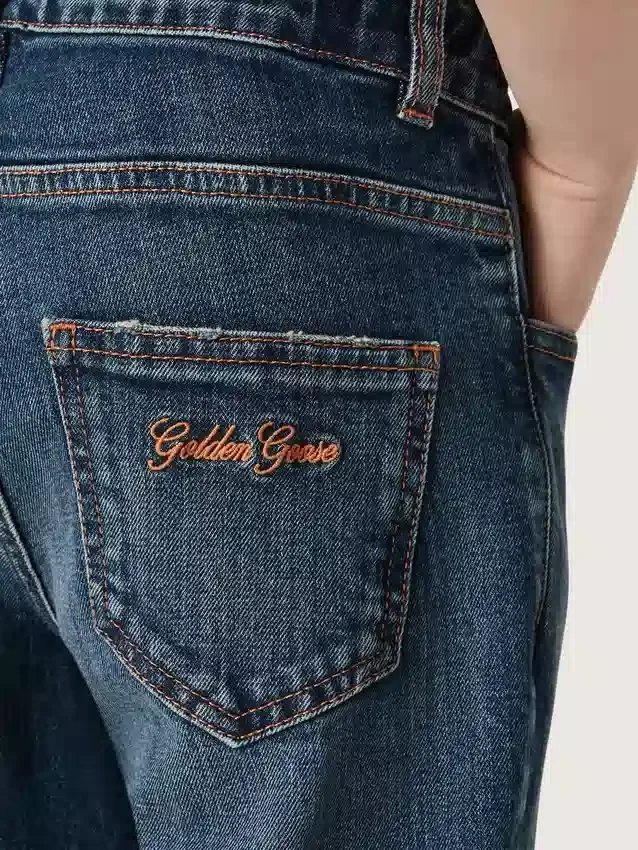 Boys' denim jeans with a raw edge and embroidery