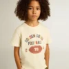 Boys’ T-shirt in worn white with multicolor lettering