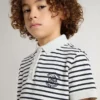 Boys' white cotton polo with navy blue stripes and embroidery
