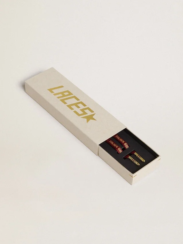 Burgundy cotton laces with contrasting gold-colored logo