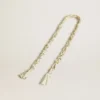 Butter-colored braided fabric charm with brass chain