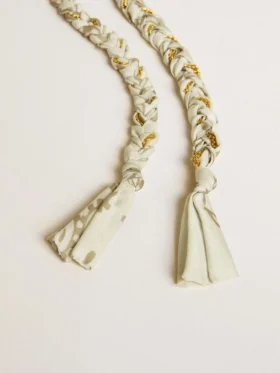 Butter-colored braided fabric charm with brass chain