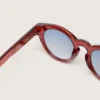 Cameron Panthos sunglasses with honey frame, precious stones and blue lenses