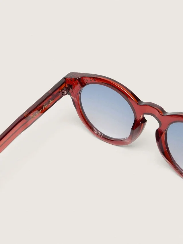 Cameron Panthos sunglasses with honey frame, precious stones and blue lenses