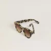 Cameron-style sunglasses with a tortoiseshell pattern