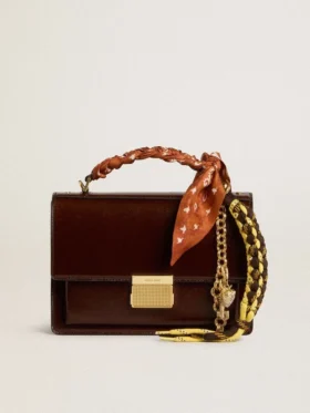 Charm with yellow and brown knotted hiking laces with chain
