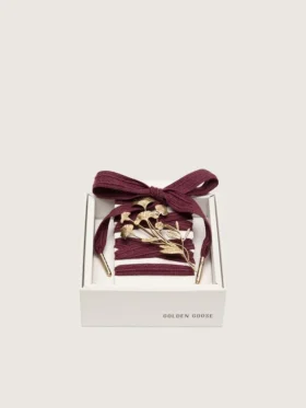 CNY Skins laces in burgundy wool with gold flower pin
