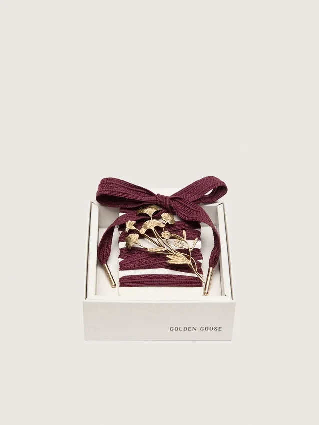 CNY Skins laces in burgundy wool with gold flower pin