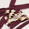 CNY Skins laces in burgundy wool with gold flower pin