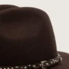 Coffee-brown hat with studded leather strap
