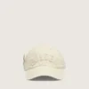 Cream baseball cap with tone-on-tone "Golden" patch and green star pin