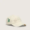 Cream baseball cap with tone-on-tone "Golden" patch and green star pin