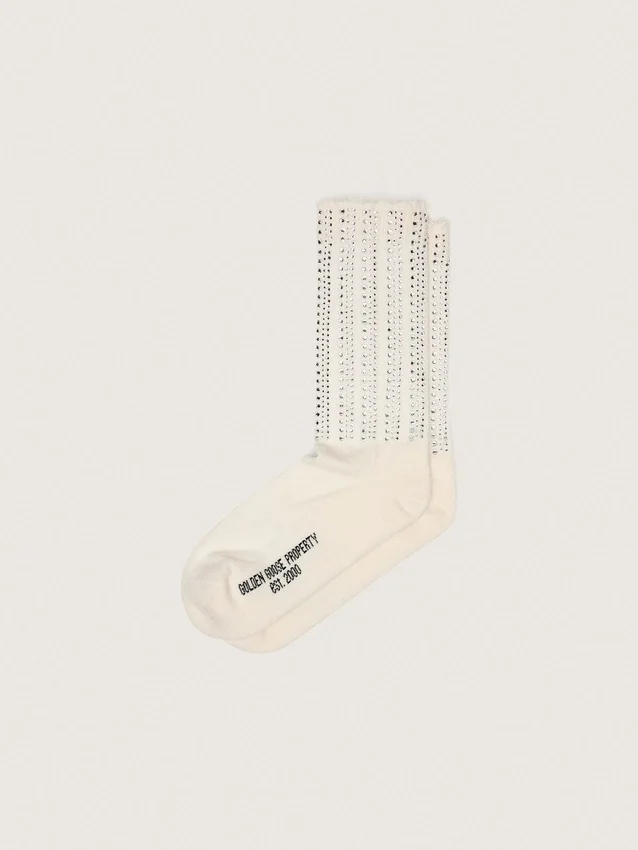Cream-colored socks with distressed details and rhinestones