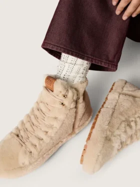 Cream-colored socks with distressed details and rhinestones