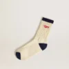 Cream ribbed socks with navy blue details and red logo
