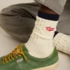 Cream ribbed socks with navy blue details and red logo