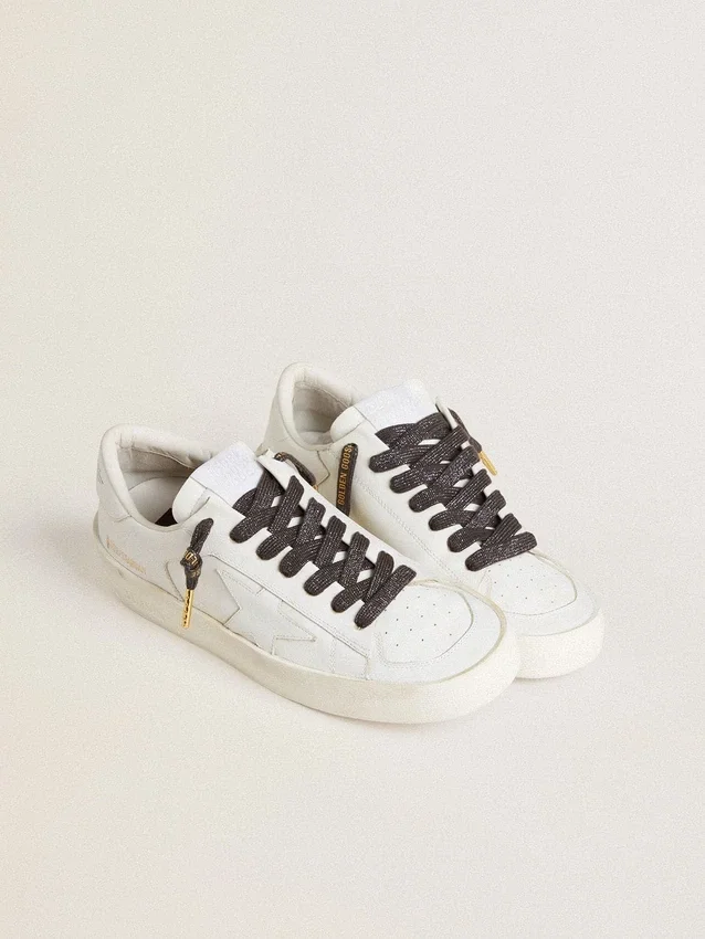 Dark gray lurex laces with contrasting gold logo