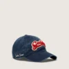 Denim blue baseball cap with red and white terry “Golden” patch
