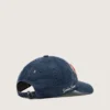 Denim blue baseball cap with red and white terry “Golden” patch