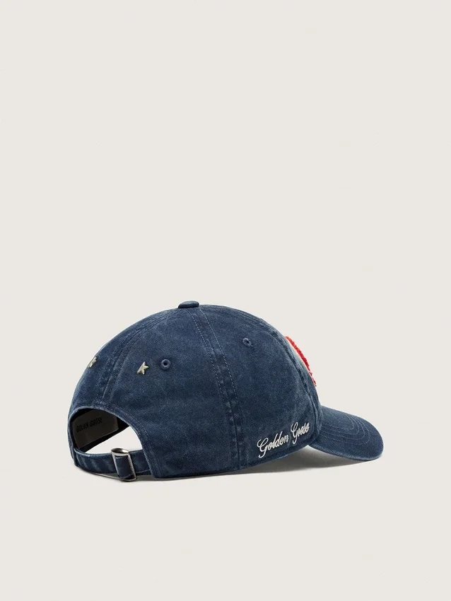 Denim blue baseball cap with red and white terry “Golden” patch