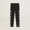 Girls’ black leggings with white stars on the sides