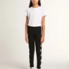 Girls’ black leggings with white stars on the sides