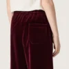 Girls’ burgundy velvet-effect pants with rear pocket